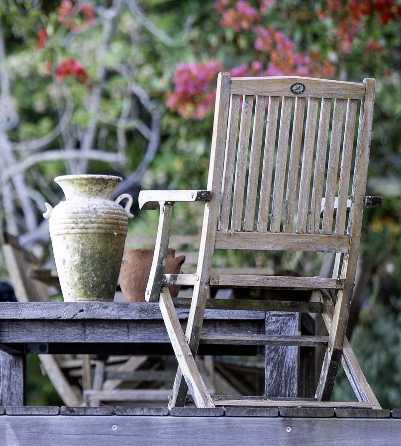Pergola with vase and teak chair